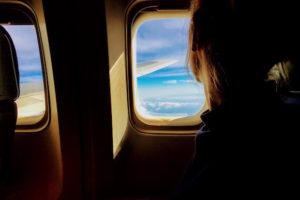 girl-window-plane-scared
