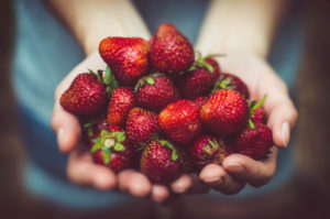 hands-holding-strawberries