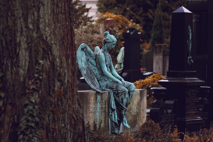 A statue of a woman praying
